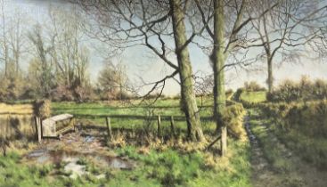 TONY WOODING (British, 20th century) oil on canvas - cattle feeder and trees by gateway, signed