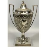 IMPRESSIVE GEORGE III SILVER LIDDED TWO-HANDLED HORSE RACING TROPHY, the main body chased with a