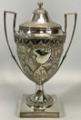 IMPRESSIVE GEORGE III SILVER LIDDED TWO-HANDLED HORSE RACING TROPHY, the main body chased with a