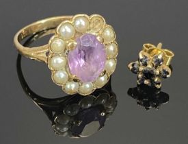9CT GOLD RING, set with a pale amethyst surrounded by split seed pearls (one missing), size K, and a