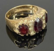 9CT YELLOW GOLD RING set with three graduated garnets, size L, 4.5g Provenance: deceased estate