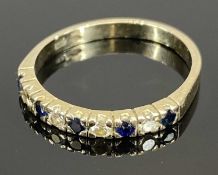 WHITE METAL RING SET WITH ALTERNATING BAND OF FIVE SAPPHIRES & FOUR DIAMONDS, marked '750', size
