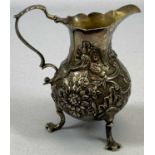 GEORGE II SILVER CREAM JUG of baluster form, with acanthus capped scrolled loop handle, floral and