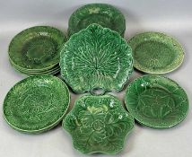 TWENTY-ONE MAIOLICA GREEN GLAZED LEAF DESIGN PLATES, 22.5cms diam., and 2 x similar serving dishes