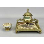 VICTORIAN ORNATE CAST BRASS INKSTAND of square form, ceramic base and inkwell decorated in the