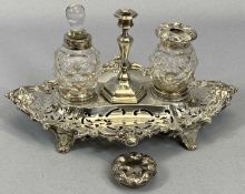 VICTORIAN SILVER INKSTAND of oval ornate form, pierced and with foliate scroll border and feet, with