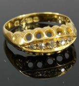 18CT YELLOW GOLD RING, set with a band of five small diamonds, size M, 3.1g Provenance: private