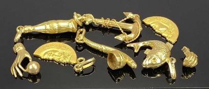 COLLECTION OF YELLOW METAL CHARMS including anchor, fish, pipe and bottle, some marked '750', 14g