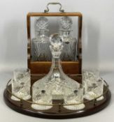 REPRODUCTION MAHOGANY TRAY with brass gallery holding a cut glass ship's decanter and stopper, 26cms