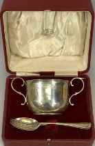 GEORGE V SILVER PORRINGER of plain circular form, with scrolled side handles, inscribed to '