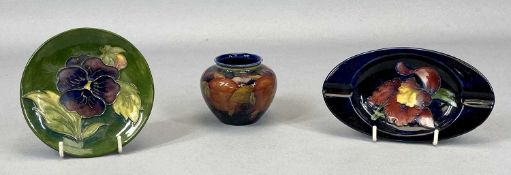 THREE SMALL MOORCROFT POTTERY ITEMS comprising a small globular vase, decorated with fruit, 6.5cms