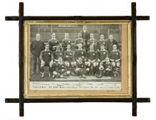 A PERIOD FRAMED BLACK & WHITE PHOTOGRAPH ENTITLED ‘THE WELSH TEAM WHICH DEFEATED NEW ZEALAND DEC