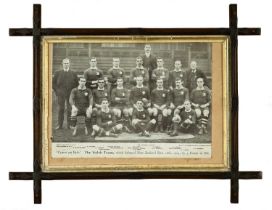 A PERIOD FRAMED BLACK & WHITE PHOTOGRAPH ENTITLED ‘THE WELSH TEAM WHICH DEFEATED NEW ZEALAND DEC