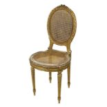 Stuhl im Stil Louis XVI, Frankreich 19. Jh., Holz reich beschnitzt und in Gold gefasst,