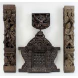 4 Schnitzereien aus schwerem, dunkel gebeiztem Holz, wohl Tibet 20. Jh., bestehend aus: gerahmtes