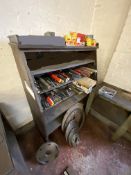 Assorted core drills on part of top shelf and  drill attachments on two full shelves, with timber