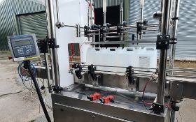 Euro-Filler Four Head Gear Pump Filler. complete with through conveyor and full digital controls,