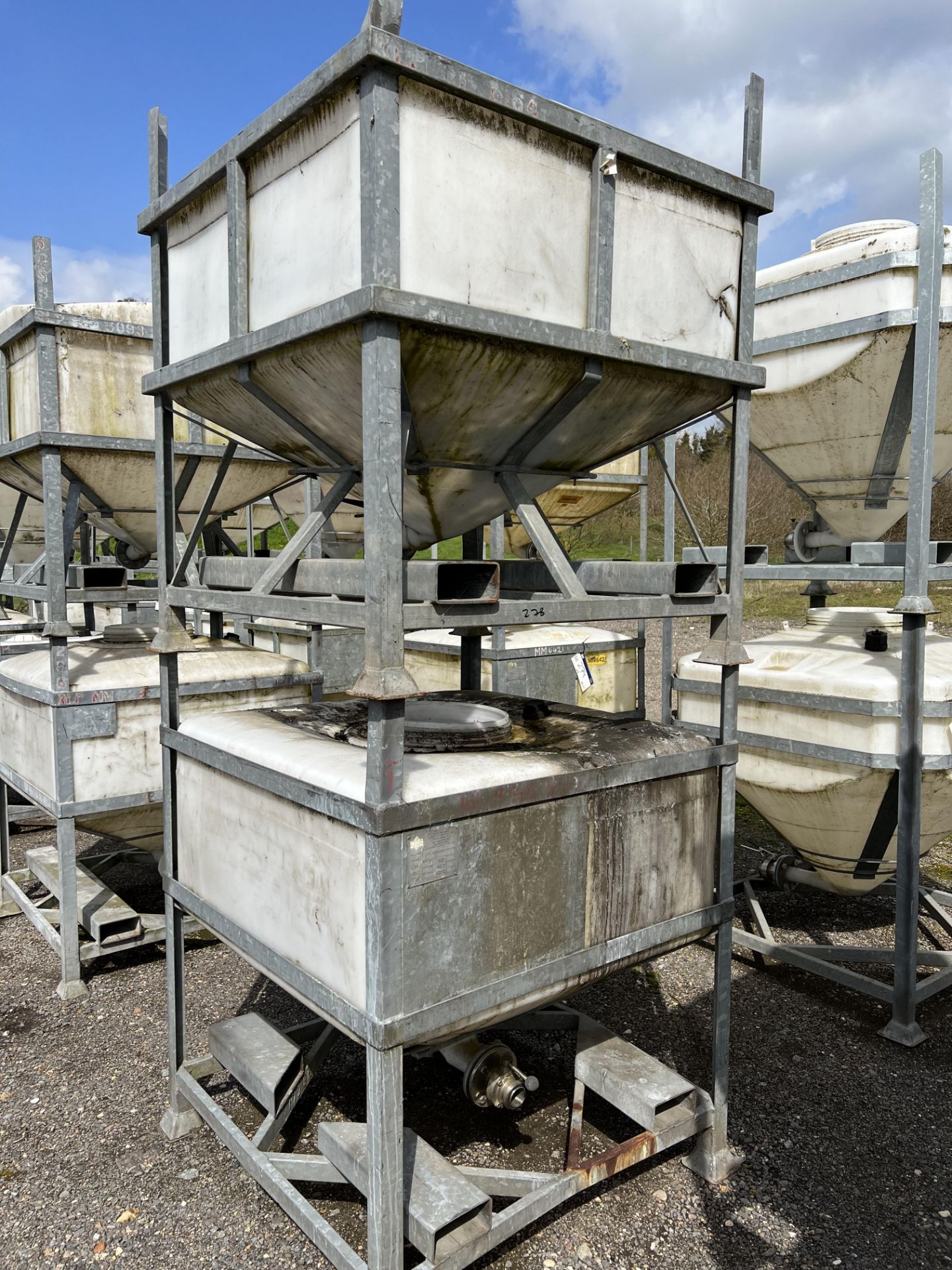 Four IBC Systems Frames, with plastic containers (some with outlet valves fitted), 750 litre - Image 2 of 4