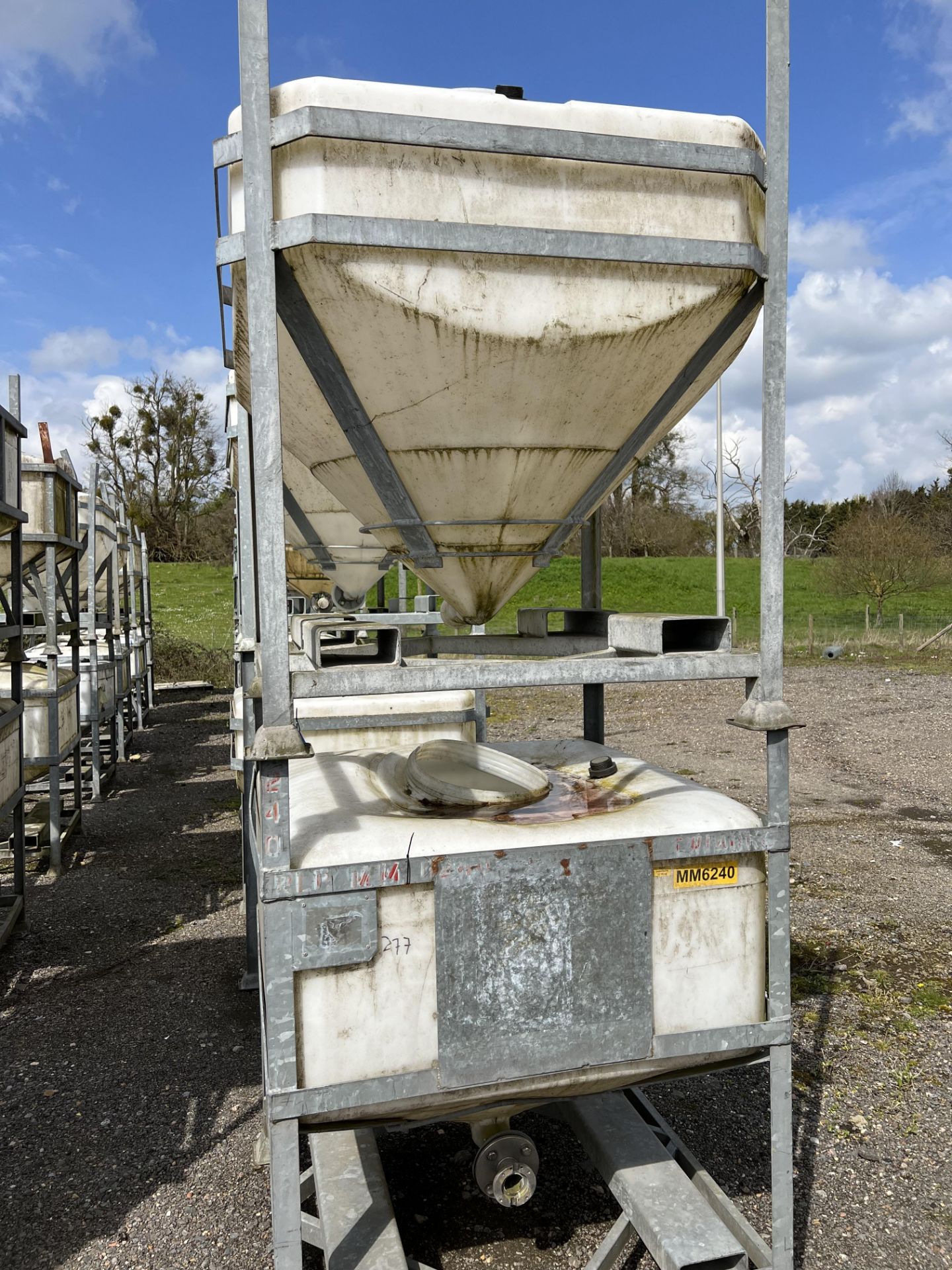 Four IBC Systems Frames, with plastic containers (some with outlet valves fitted), 750 litre - Image 2 of 4