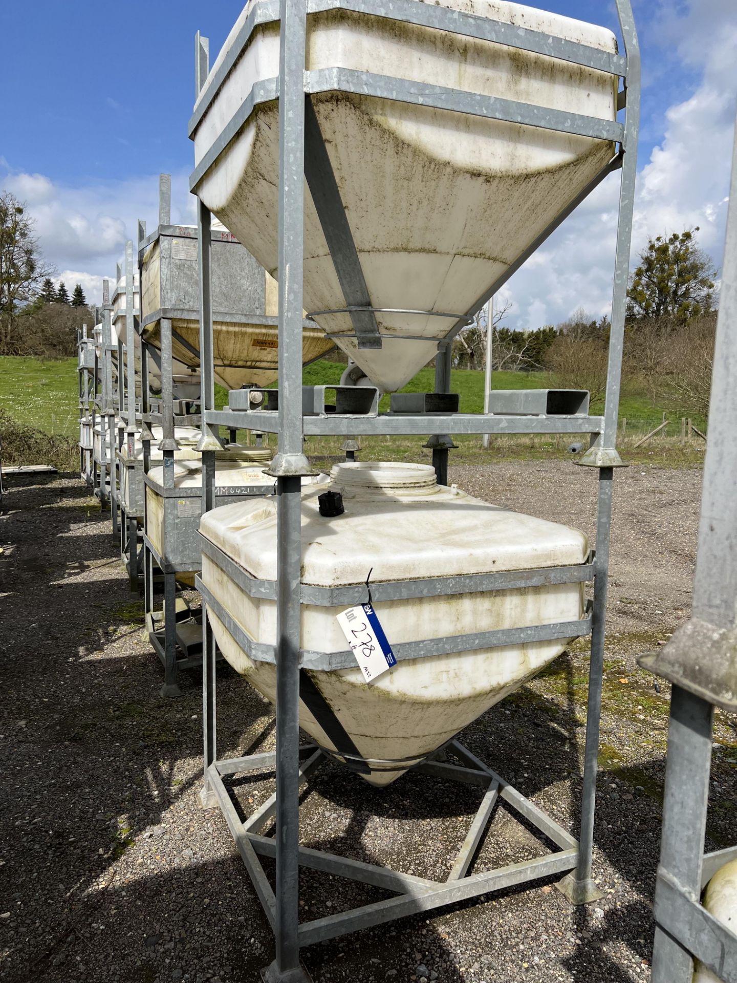 Four IBC Systems Frames, with plastic containers (some with outlet valves fitted), 750 litre