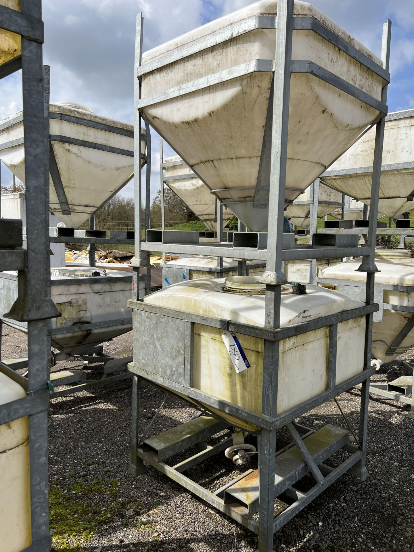 Four IBC Systems Frames, with plastic containers (some with outlet valves fitted), 750 litre