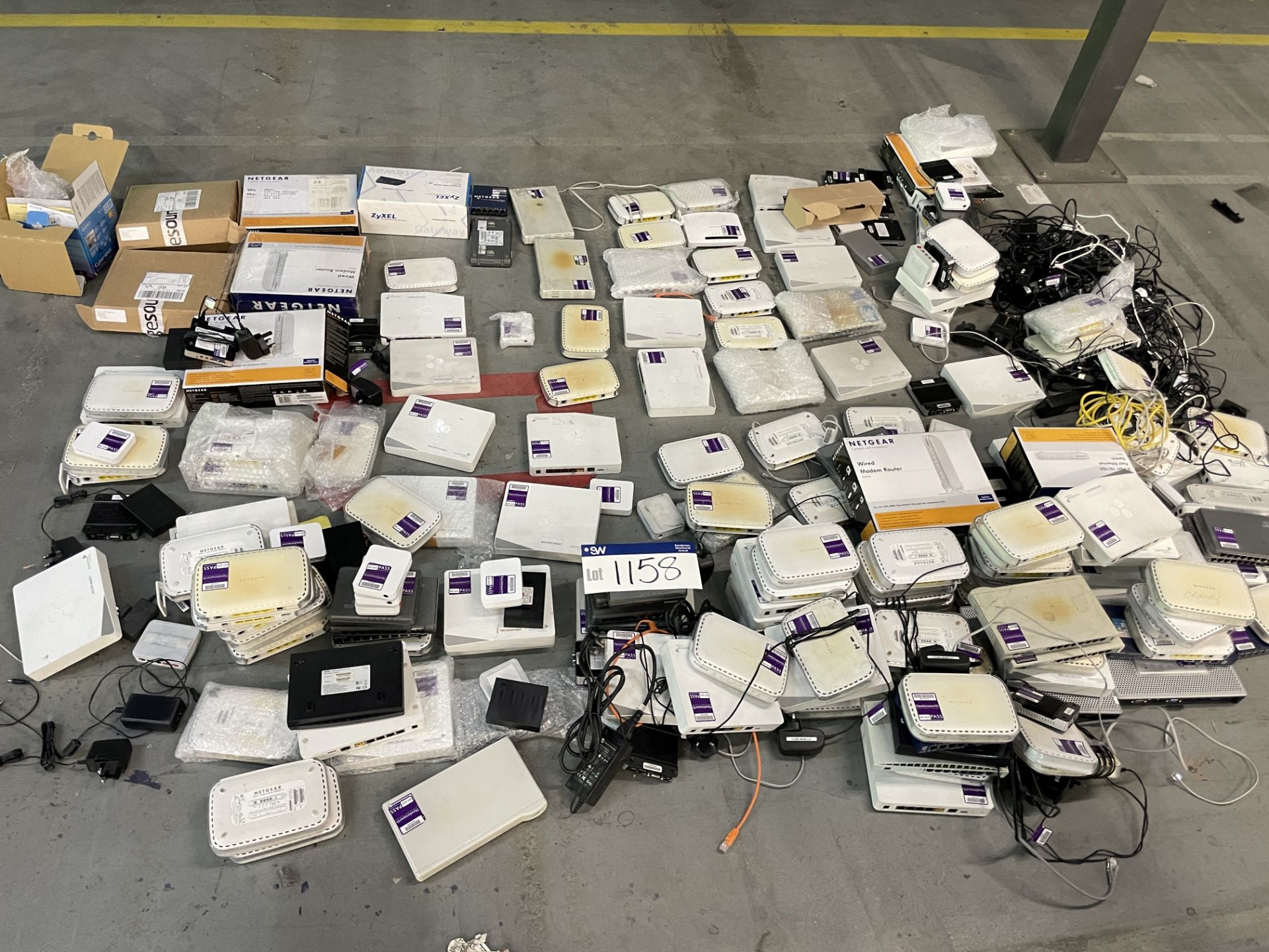 Assorted Computer Equipment, on floor, comprising mainly routers and switches, Lots Located