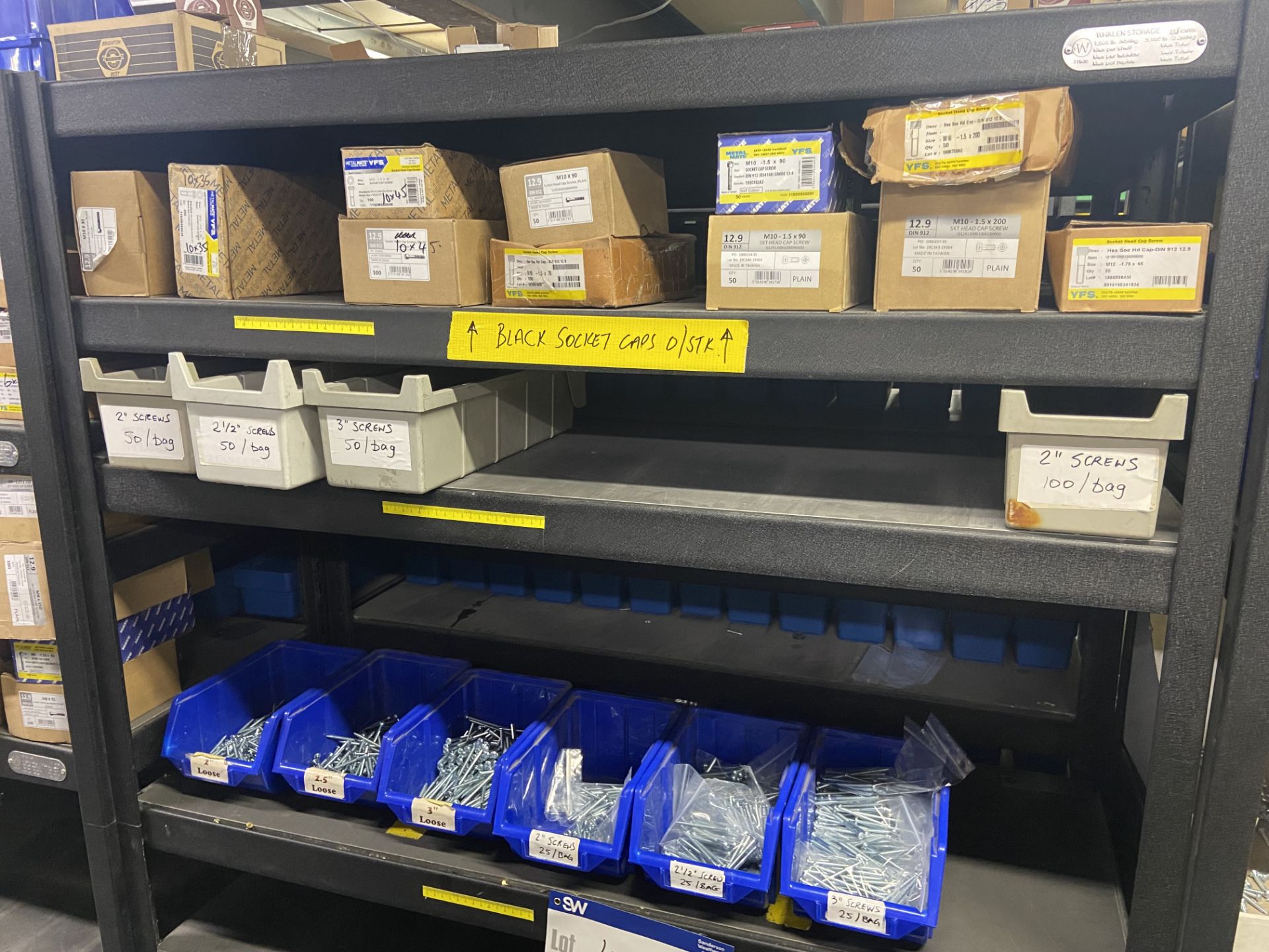 Quantity of Black Socket Caps & Pan Head Screws, with plastic stacking bins, as set out on one bay