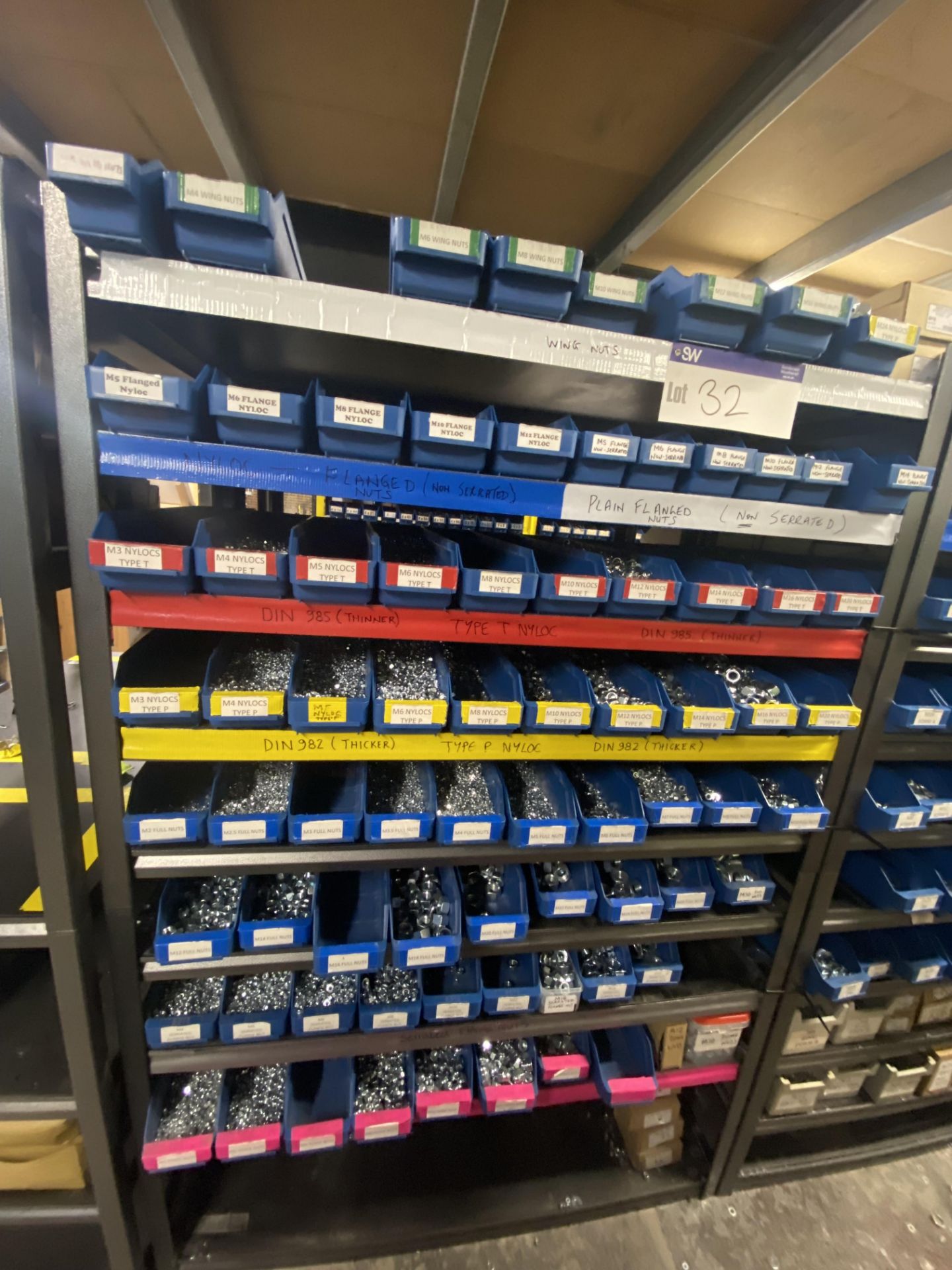 Quantity of Assorted Nuts, with plastic stacking bins, as set out on one bay of rack (rack