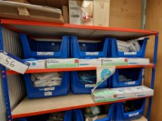 Quantity of PPE, including Gloves, Overalls, Overshoes, Hair Nets, as set out on two shelves of