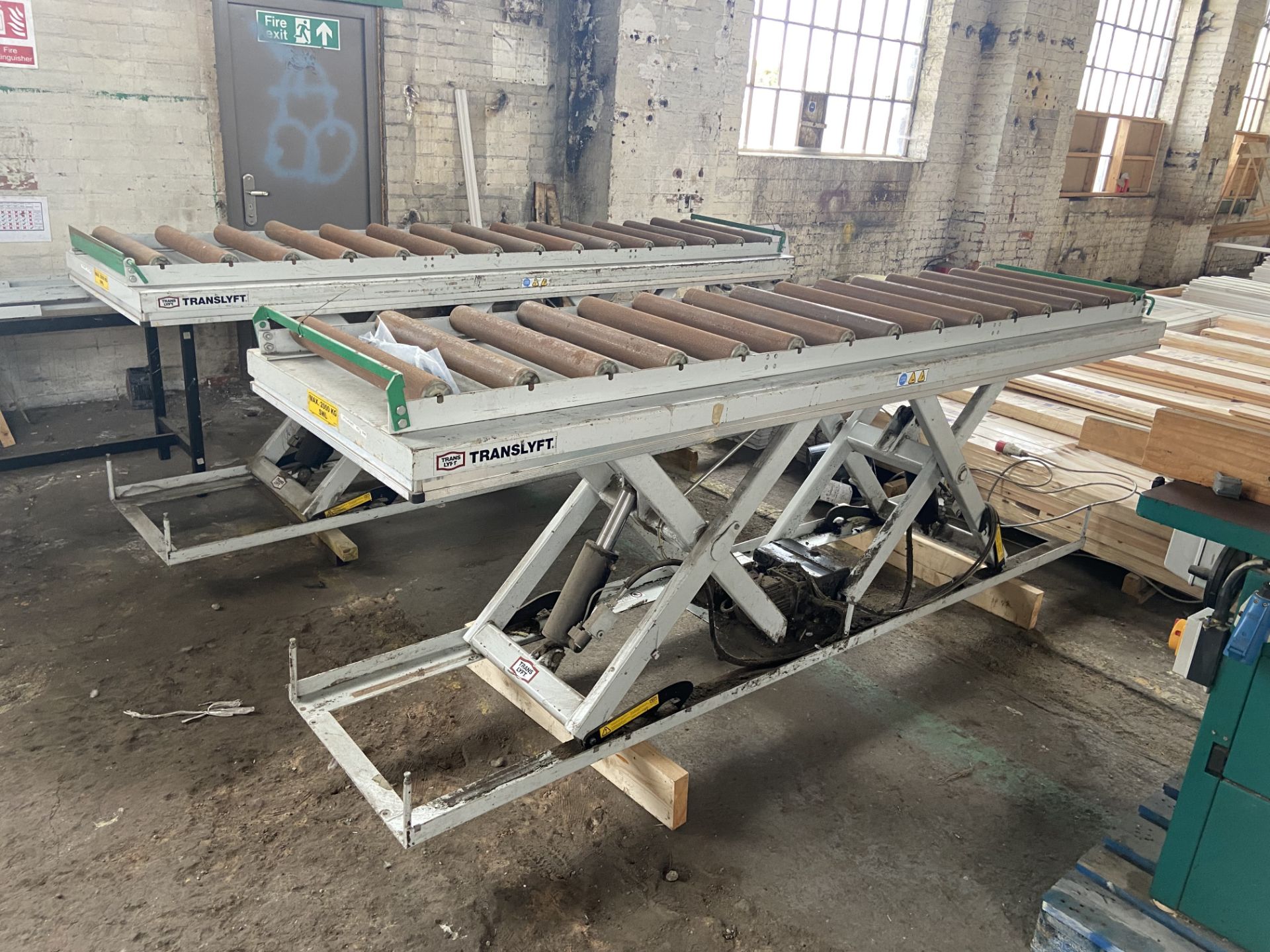 PRODUCTION LINE CONVEYORING, complete with two Translift 2000kg SWL roller conveyor scissor lifts,