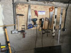 Assorted Hand Tools, as set out on wall, including clamps, drill, saws, angle grinder, pneumatic