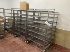 FOUR STAINLESS STEEL SEVEN TIER DOUBLE SIDED MOBILE RACKS, each approx. 1m x 1m x 1.85m high overall