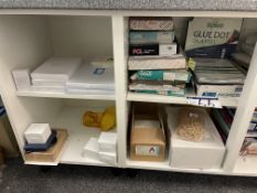 Contents of Three Shelves Including Various Labels, Corner Pockets and Encapsulation Pouches