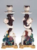 Paar Leuchter, figürlich, Putto mit Füllhorn, polychrom bemalt, vergoldeter Sockel, Blüten best., 2