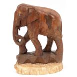 Figur "Stehender Elefant", Ebenholz, geschnitzt, auf versteinerter Holzplatte, Gebrauchspuren, Ges.