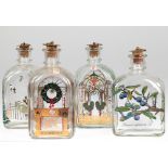 4 Holmegaard-Flaschen, davon drei mit Weihnachtsmotiven, 1984, 1988 und 1994, mit Org. Stopfen, Geb