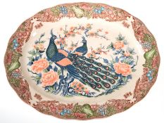 Platte, oval, Keramik, Spiegel mit Pfauen- und Blütendekor, Fahne mit Obstdekor auf beigem Grund, z