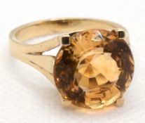 Ring, 585er GG,  mit rund facettiertem Citrin von ca. 10 ct., ges. 6,9 g, RG 60