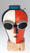 "Kopf 58 mit Schutzbrille und Nagel", suprematistisch, 1950er Jahre, Pappmaché, polychrom gefaßt, H