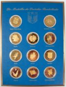 "Die Medaillen der Deutschen Bundesländer", 11 Stück,  Metall vergoldet, Dm. je 4 cm, im Rahmen, ge