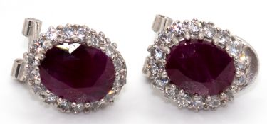 Paar Ohrringe, 925 rhodiniert, echte Rubine ca. 9 x 7 mm, Entourage aus weißen Zirkonia in Brillant