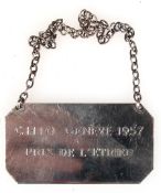 Plakette an Kette, Silber (geprüft, unleserl. Punzen ), achteckig mit Inschrift "Chio Geneve 1957- 