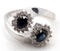 Ring "Toi & Moi,“ WG 14 kt., ca. 5,1 g, 2 Saphire mit Brillant-Entourage von ca. 0,30 ct.,RG 55 , I