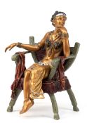 Bronze-Figur "Orientalische Dame auf Armlehnstuhl sitzend", 2-teilig, Nachguß, farbig und messingfa