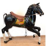 Karussell-Pferd, um 1900, Holz farbig gefaßt, starke Gebrauchspuren, Beine repariert, Schweif teilw