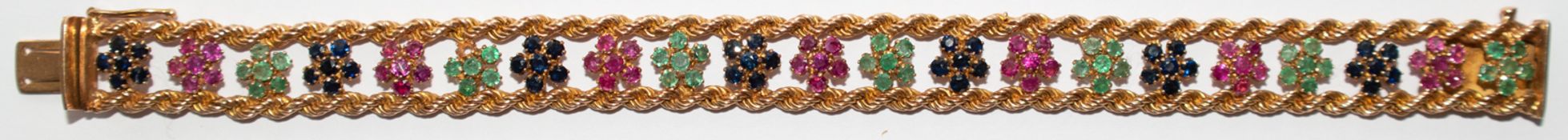 Armband, 585er RG, zwischen Kordelbändern je 7 Blüten aus Rubinen, Saphiren und Smaragden (1 Stein 