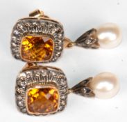 Ohrstecker, 750er GG, vollflächig facettierte Citrine von zus. 4,09 ct. 