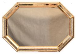 Spiegel, 20. Jh., achteckiger Messing-Rahmen mit Spiegelelementen und floralen Messing-Applikatione