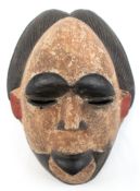 Afrikanische Maske, Holz geschnitzt, farbig gefaßt, 13x31,5x21 cm