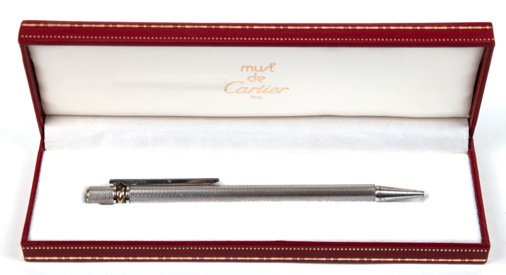 Kugelschreiber von Cartier, sog. "Must de Cartier", silberfarben, teilw. farbig emailliert, Korpus 